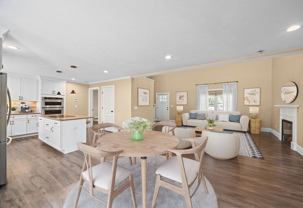 Dining room, Fireplace, Interior, Kitchen, Living room, Recessed Lighting, Stainless Steel Appliances, Wood Texture Flooring