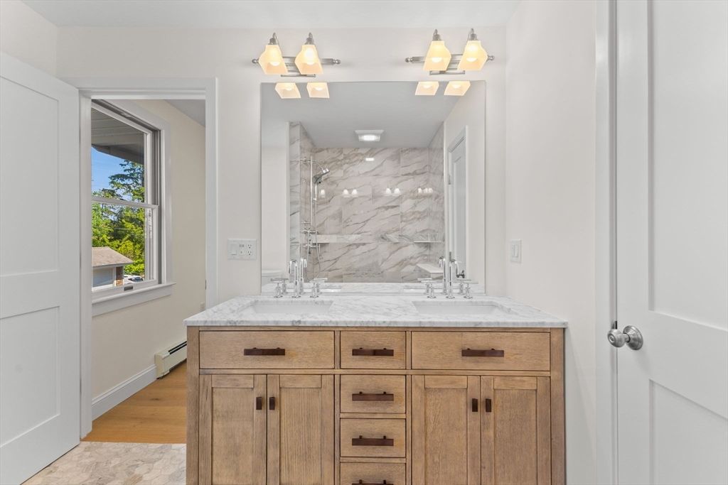 Bathroom, Dual Sink Vanities, Interior, Marble Walls, Wood Texture Flooring