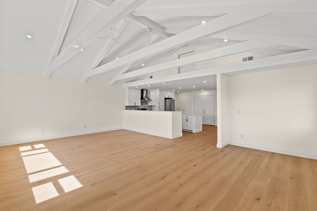 Empty room, Interior, Kitchen, Recessed Lighting, Stainless Steel Appliances, Wood Texture Flooring