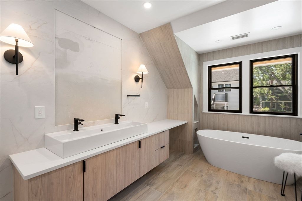 Bathroom, Dual Sink Vanities, Free Standing Baths, Interior, Marble Walls, Recessed Lighting, Wood Texture Flooring