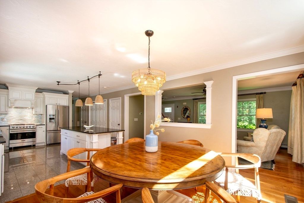 Chandelier, Dining room, Interior, Kitchen, Pendant Lights, Stainless Steel Appliances, Wood Texture Flooring