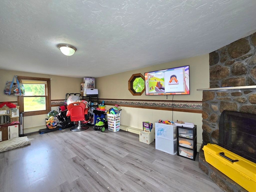 Fireplace, Fitness Equipment, Interior, Stone Walls, Wood Texture Flooring