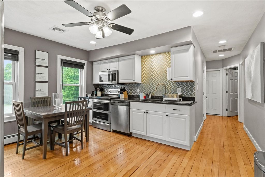 Dining room, Interior, Kitchen, Recessed Lighting, Stainless Steel Appliances, Wood Texture Flooring