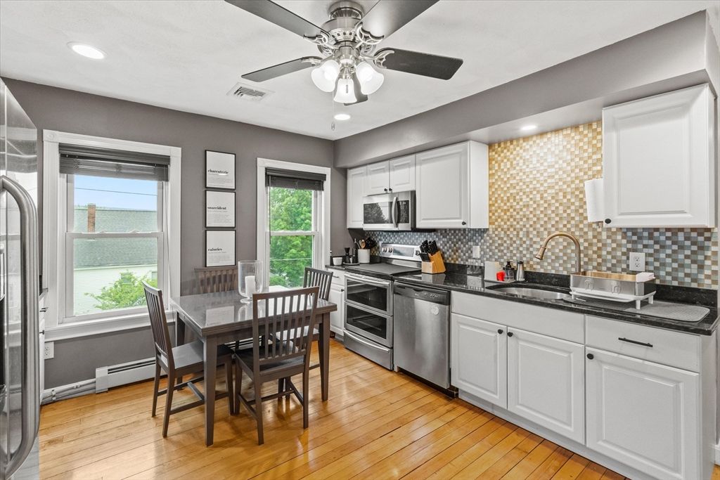 Dining room, Interior, Kitchen, Recessed Lighting, Stainless Steel Appliances, Wood Texture Flooring