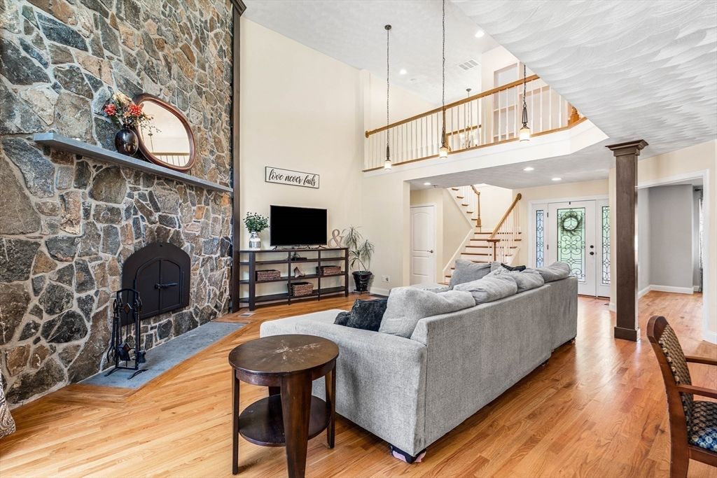 Fireplace, Interior, Living room, Pendant Lights, Recessed Lighting, Stone Walls, Wood Texture Flooring