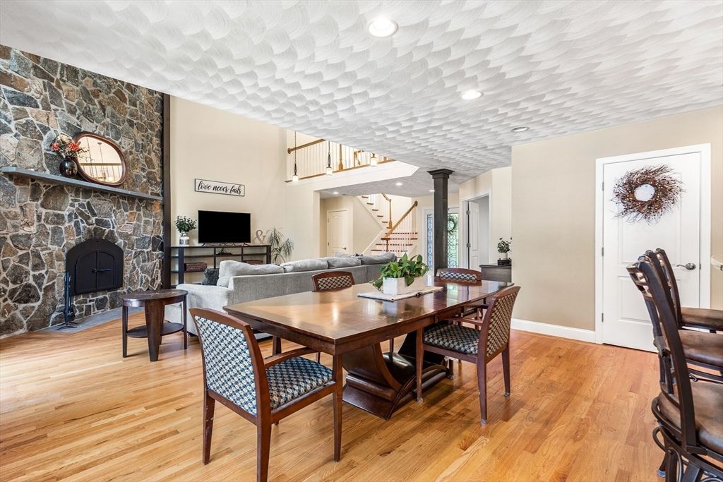 Dining room, Fireplace, Interior, Living room, Pendant Lights, Recessed Lighting, Stone Walls, Wood Texture Flooring