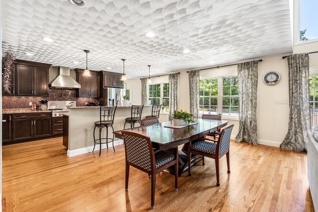 Dining room, Interior, Kitchen, Pendant Lights, Recessed Lighting, Stainless Steel Appliances, Wood Texture Flooring