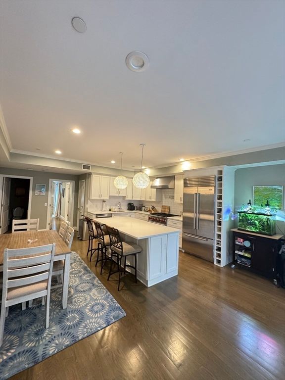 Dining room, Interior, Kitchen, Pendant Lights, Recessed Lighting, Stainless Steel Appliances, Wood Texture Flooring