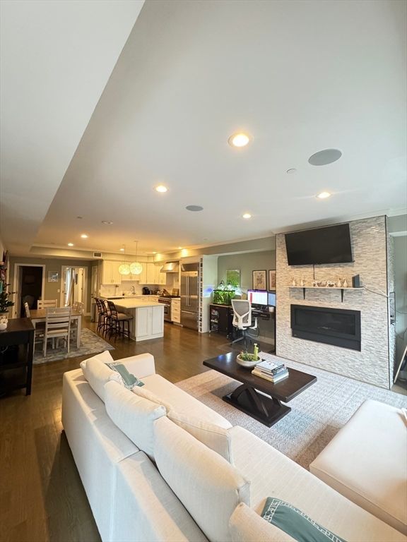 Dining room, Fireplace, Interior, Kitchen, Living room, Pendant Lights, Recessed Lighting, Stainless Steel Appliances, Stone Walls, Wood Texture Flooring