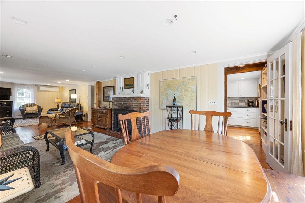 Dining room, Fireplace, Interior, Living room, Recessed Lighting, Wood Texture Flooring