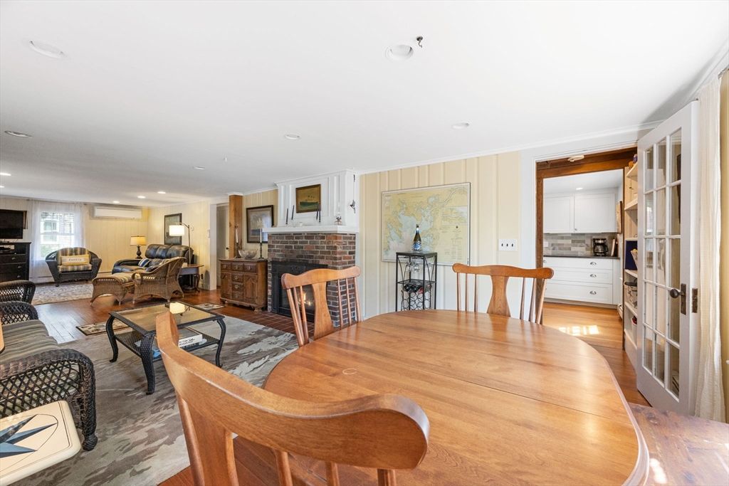 Dining room, Fireplace, Interior, Living room, Recessed Lighting, Wood Texture Flooring