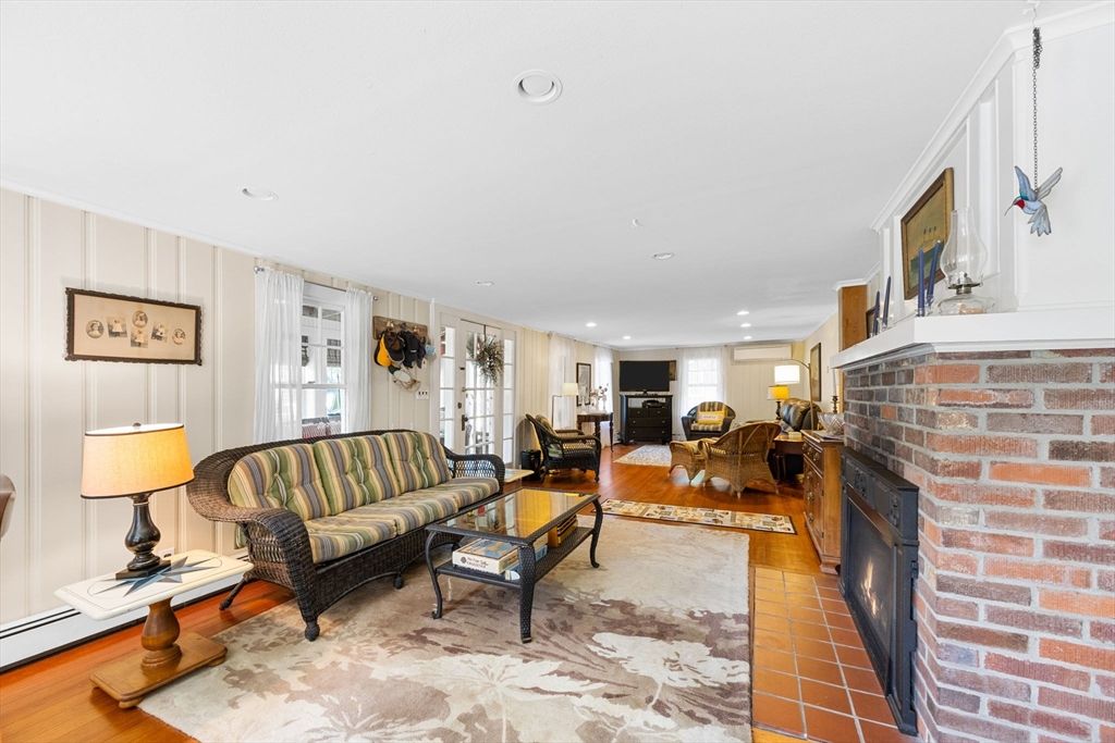 Fireplace, Interior, Living room, Recessed Lighting, Stone Walls, Wood Texture Flooring