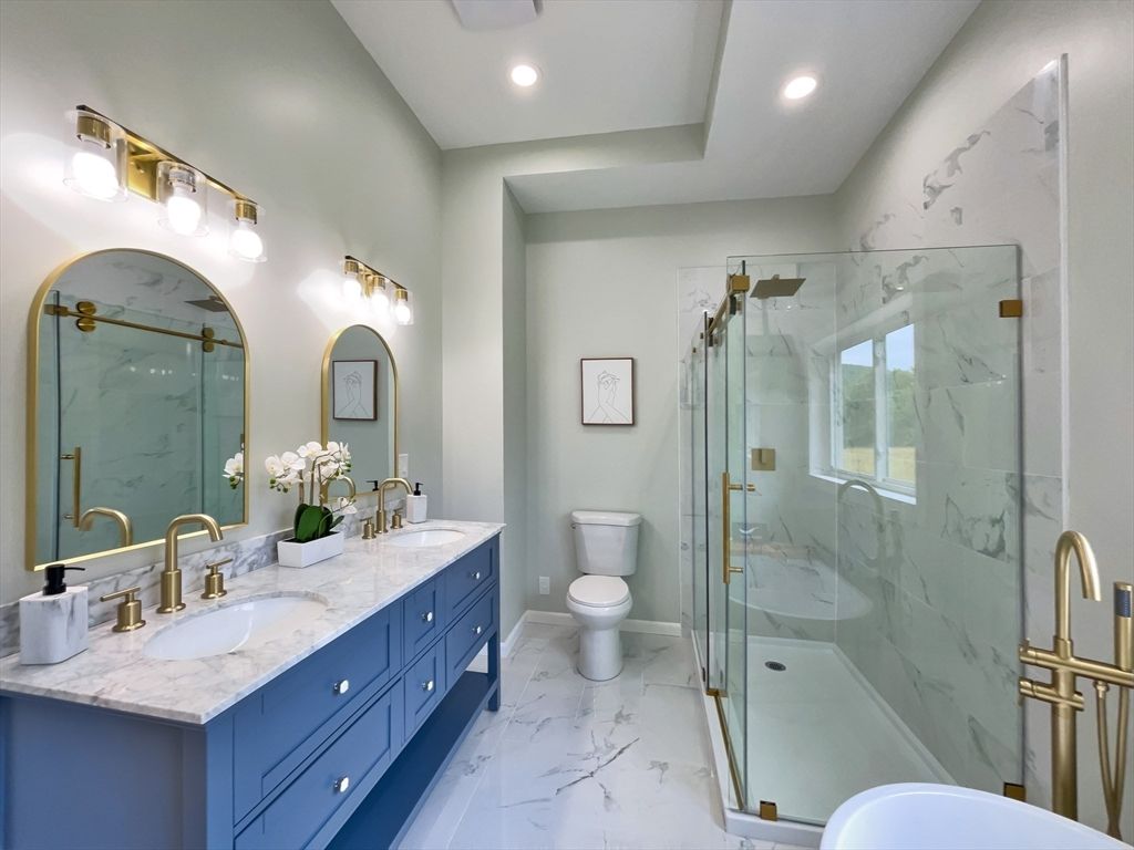 Bathroom, Dual Sink Vanities, Glass Shower, Interior, Marble, Marble Walls, Recessed Lighting