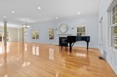 Chandelier, Empty room, Fireplace, Interior, Piano, Recessed Lighting, Wood Texture Flooring