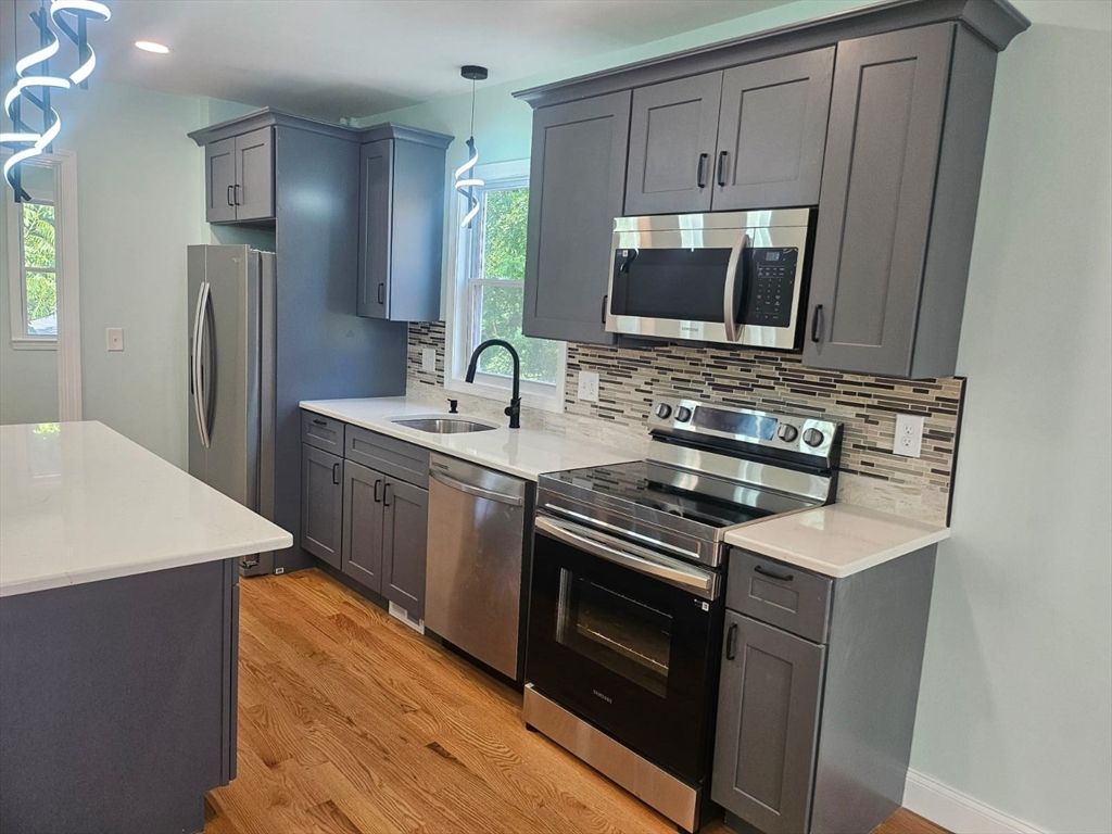 Interior, Kitchen, Pendant Lights, Recessed Lighting, Stainless Steel Appliances, Wood Texture Flooring
