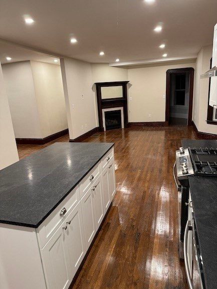 Empty room, Fireplace, Interior, Kitchen, Recessed Lighting, Wood Texture Flooring