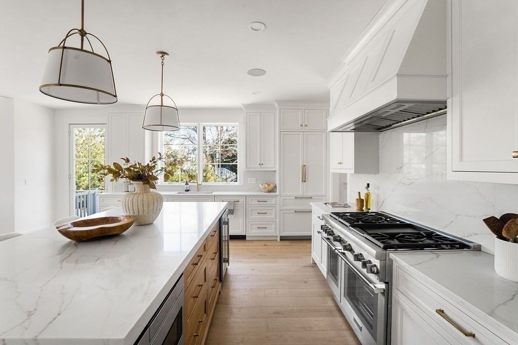 Interior, Kitchen, Marble Walls, Pendant Lights, Recessed Lighting, Stainless Steel Appliances, Wood Texture Flooring