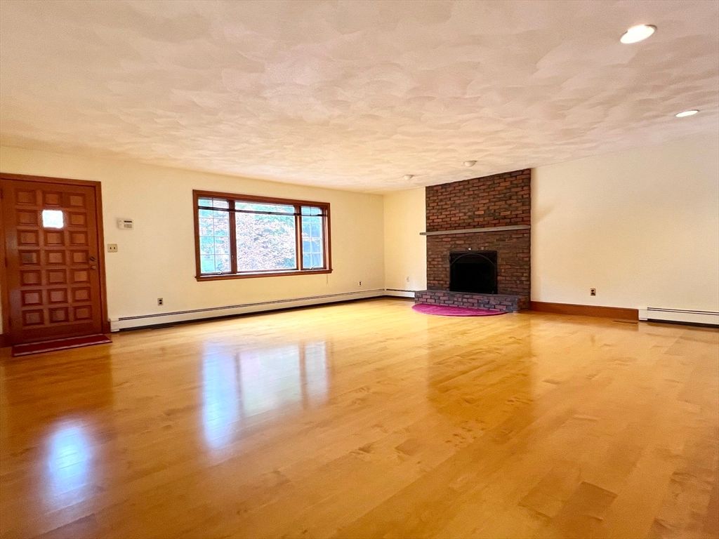 Empty room, Fireplace, Interior, Recessed Lighting, Stone Walls, Wood Texture Flooring