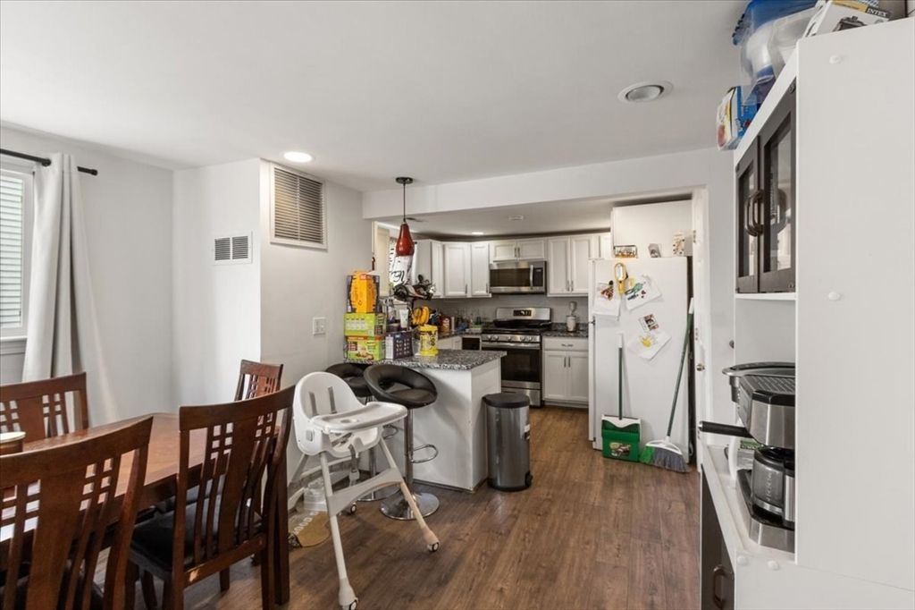Dining room, Interior, Kitchen, Pendant Lights, Recessed Lighting, Stainless Steel Appliances, Wood Texture Flooring