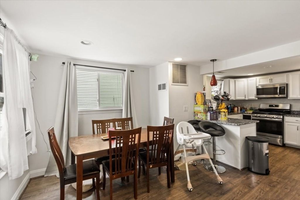 Dining room, Interior, Kitchen, Pendant Lights, Recessed Lighting, Stainless Steel Appliances, Wood Texture Flooring