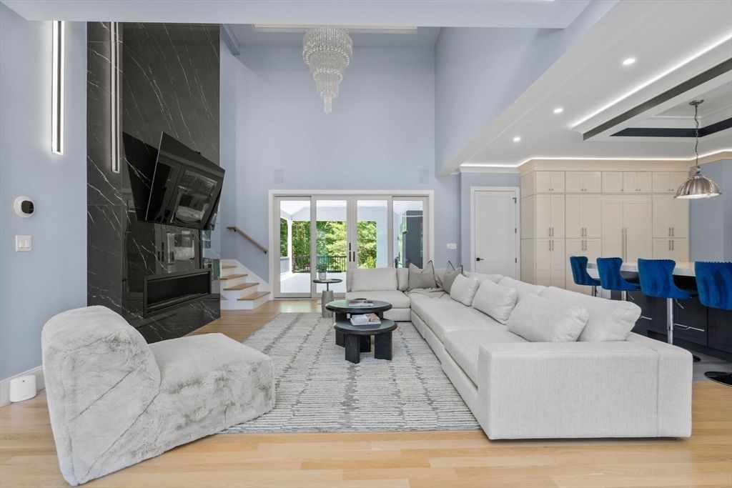 Dining room, Fireplace, Interior, Living room, Marble Walls, Pendant Lights, Recessed Lighting, Wood Texture Flooring