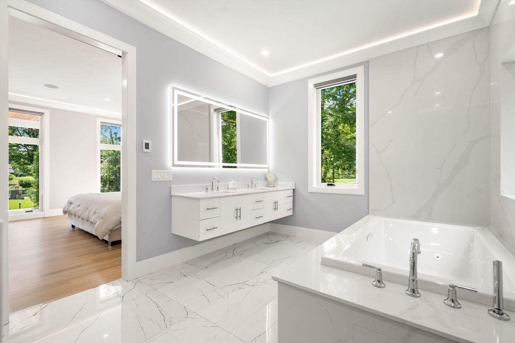 Bathroom, Dual Sink Vanities, Interior, Marble, Marble Walls, Recessed Lighting, Wood Texture Flooring