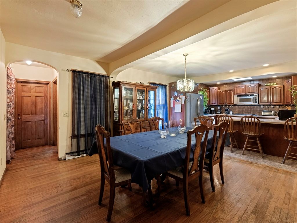 Chandelier, Dining room, Interior, Kitchen, Pendant Lights, Recessed Lighting, Stainless Steel Appliances, Wood Texture Flooring