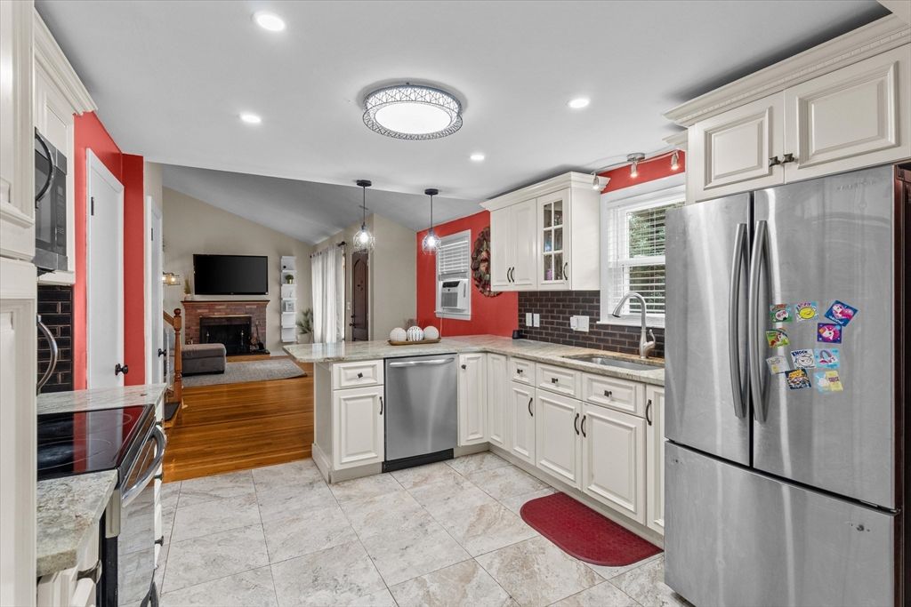 Fireplace, Interior, Kitchen, Living room, Pendant Lights, Recessed Lighting, Stainless Steel Appliances, Wood Texture Flooring
