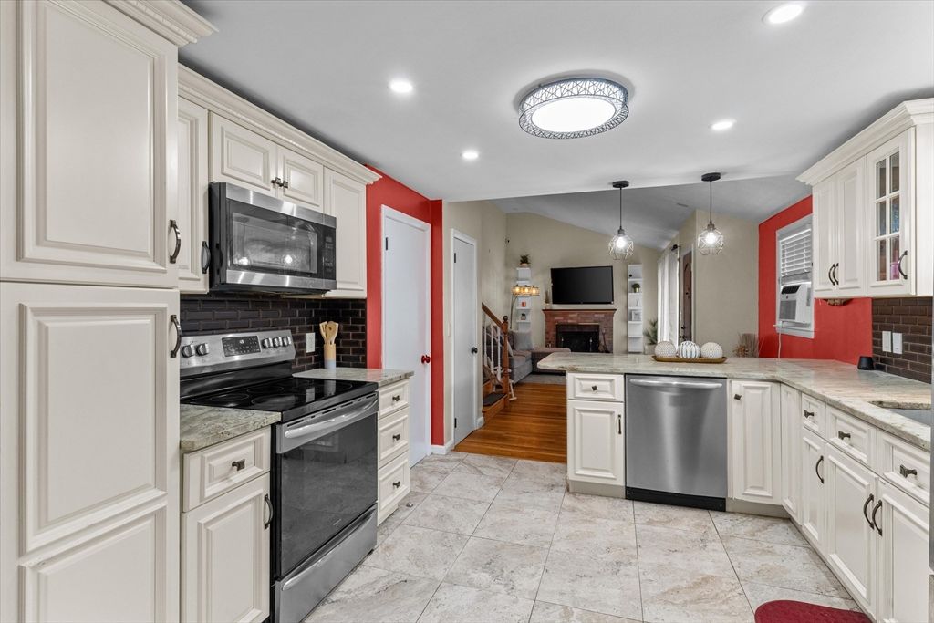Fireplace, Interior, Kitchen, Pendant Lights, Recessed Lighting, Stainless Steel Appliances, Wood Texture Flooring