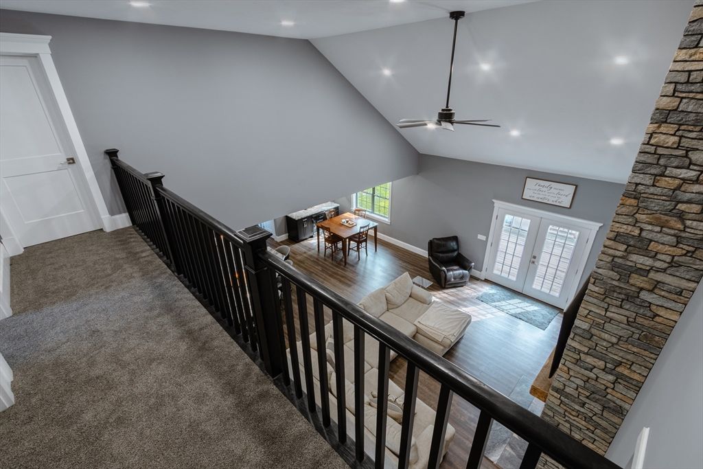Dining room, Fireplace, Interior, Recessed Lighting, Stone Walls, Wood Texture Flooring