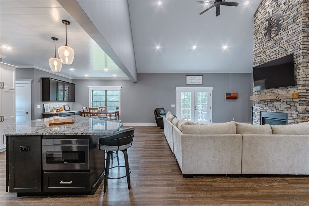 Fireplace, Interior, Kitchen, Living room, Pendant Lights, Recessed Lighting, Stone Walls, Wood Texture Flooring