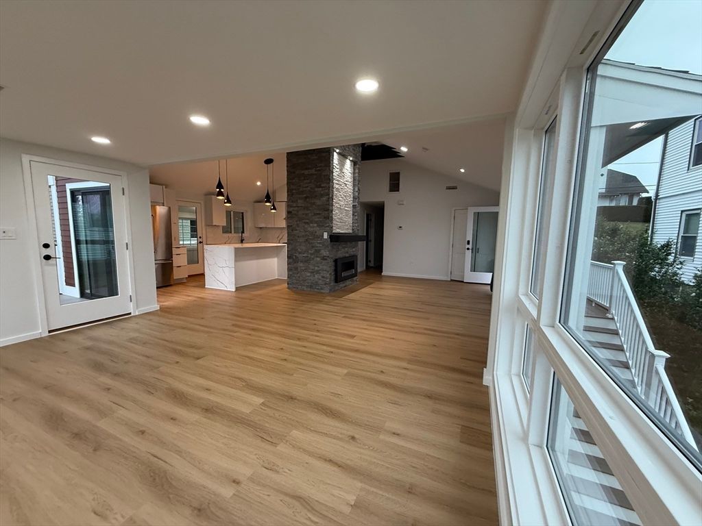Empty room, Fireplace, Interior, Kitchen, Pendant Lights, Recessed Lighting, Wood Texture Flooring