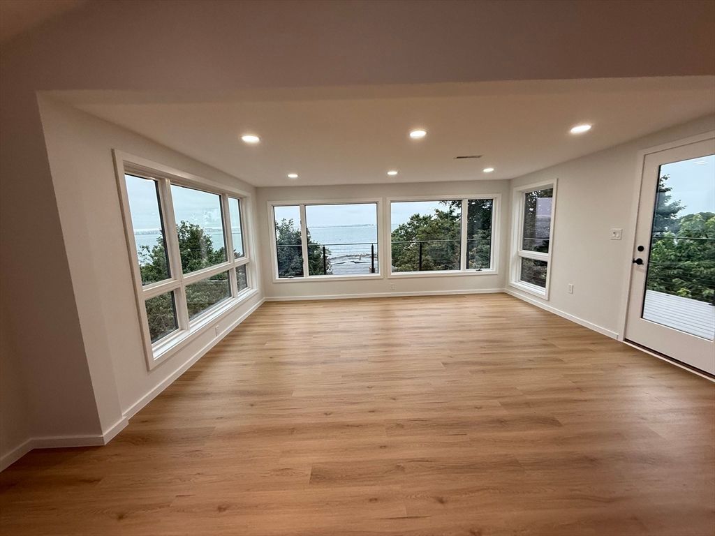 Empty room, Fireplace, Interior, Recessed Lighting, Water, Wood Texture Flooring