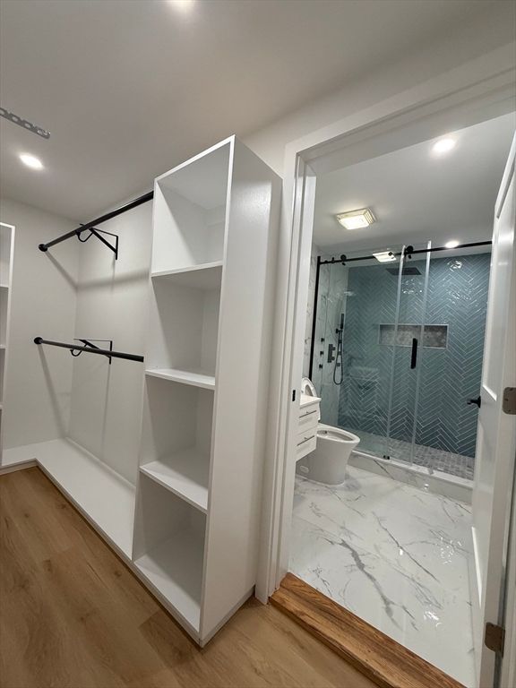 Bathroom, Glass Shower, Interior, Marble, Recessed Lighting, Walk-in Closets, Wood Texture Flooring