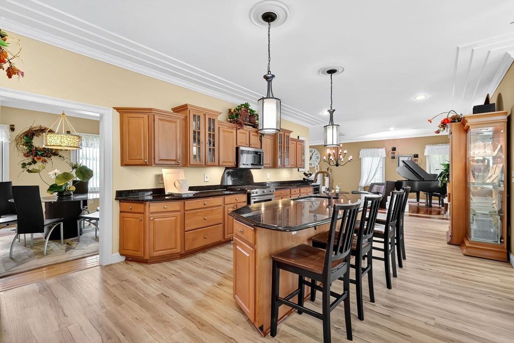 Chandelier, Dining room, Interior, Kitchen, Pendant Lights, Recessed Lighting, Stainless Steel Appliances, Wood Texture Flooring
