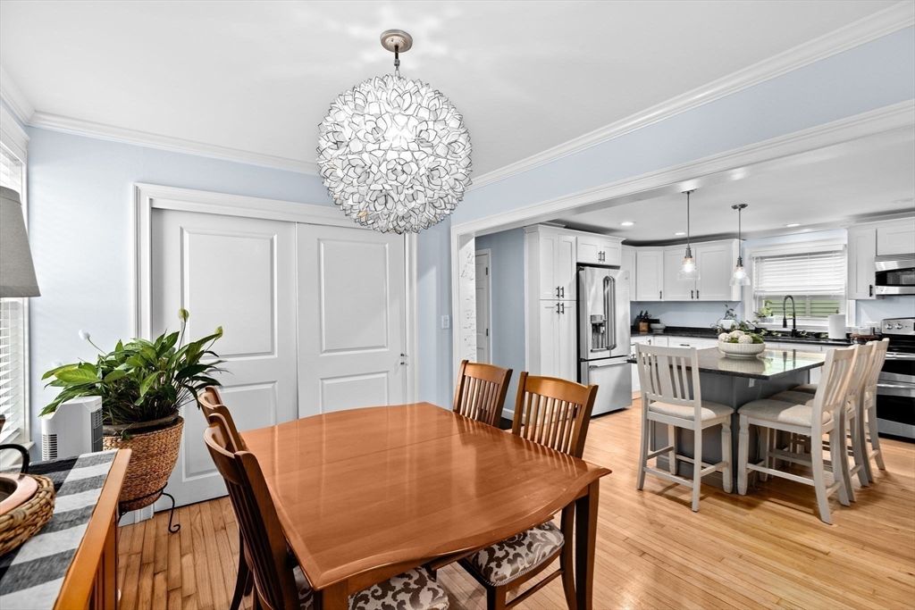 Chandelier, Dining room, Interior, Kitchen, Pendant Lights, Recessed Lighting, Stainless Steel Appliances, Wood Texture Flooring