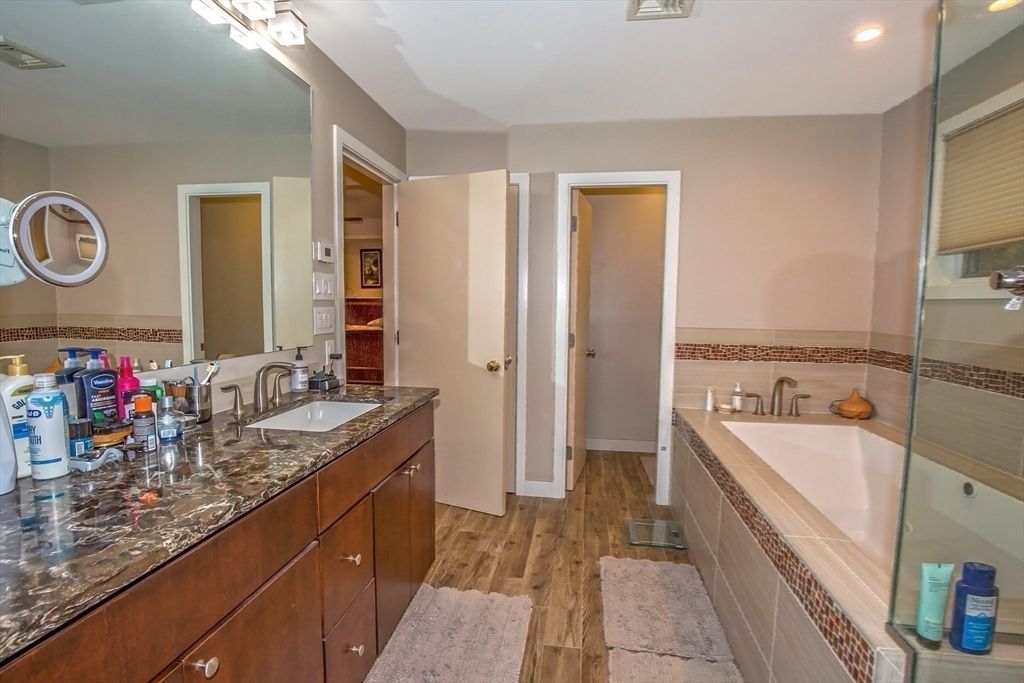 Bathroom, Dual Sink Vanities, Glass Shower, Interior, Recessed Lighting, Wood Texture Flooring