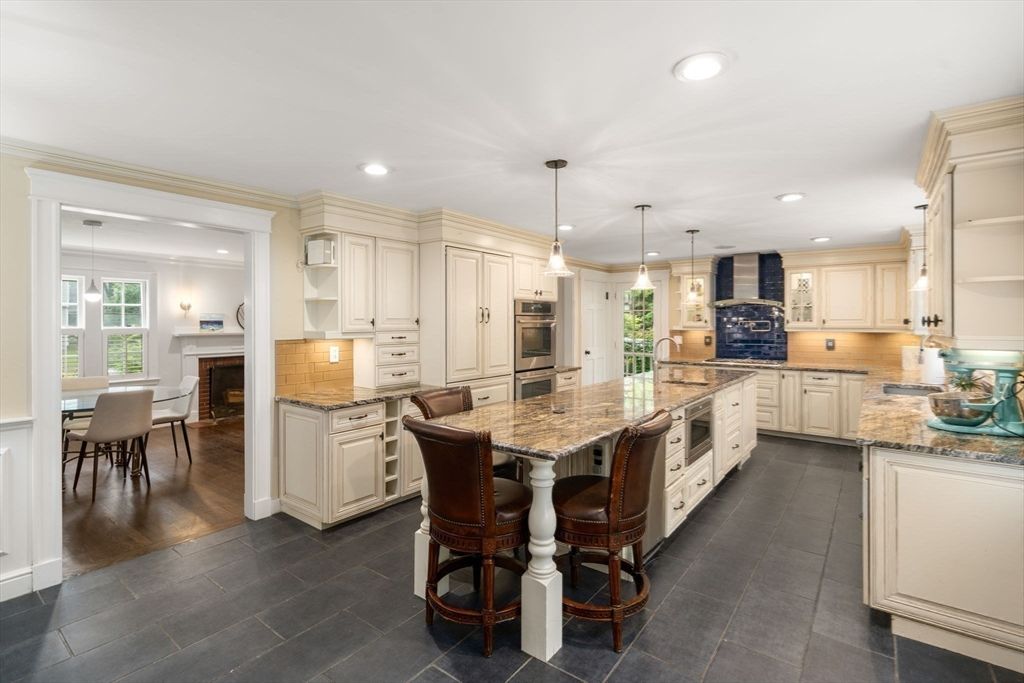 Dining room, Fireplace, Interior, Kitchen, Pendant Lights, Recessed Lighting, Stainless Steel Appliances, Wood Texture Flooring