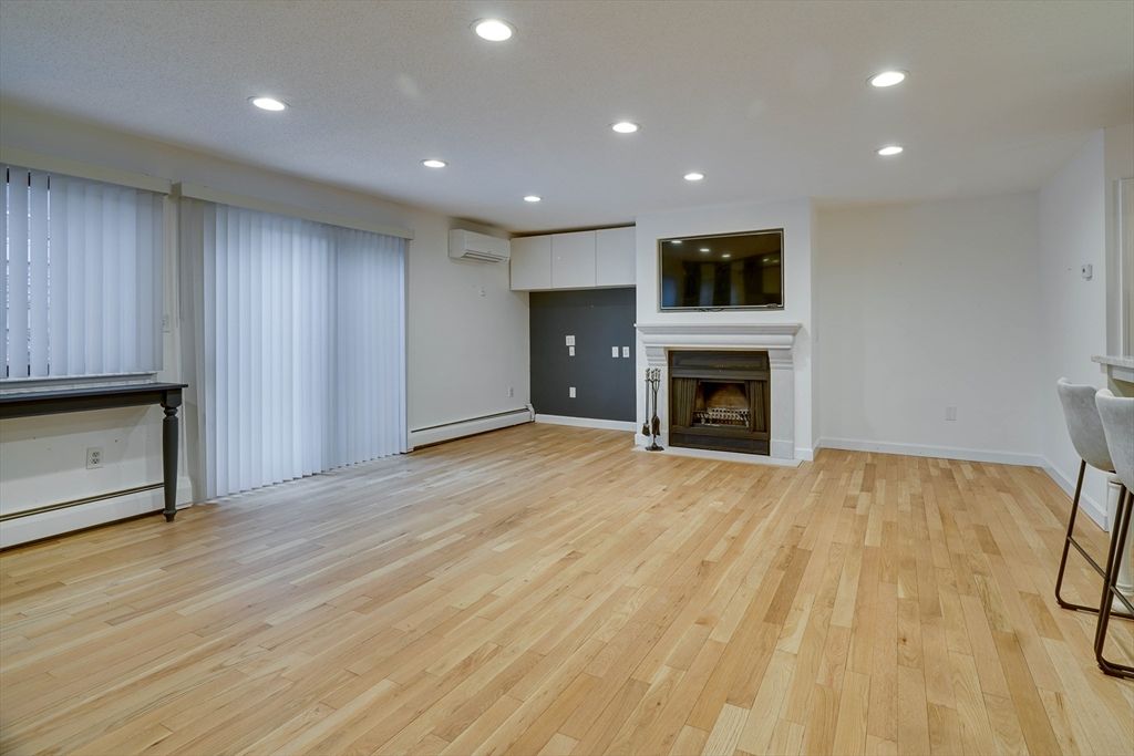 Empty room, Fireplace, Interior, Recessed Lighting, Wood Texture Flooring