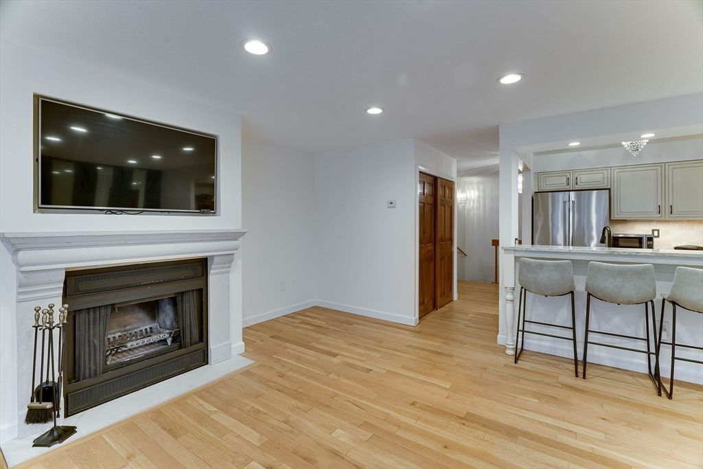 Fireplace, Interior, Kitchen, Recessed Lighting, Stainless Steel Appliances, Wood Texture Flooring