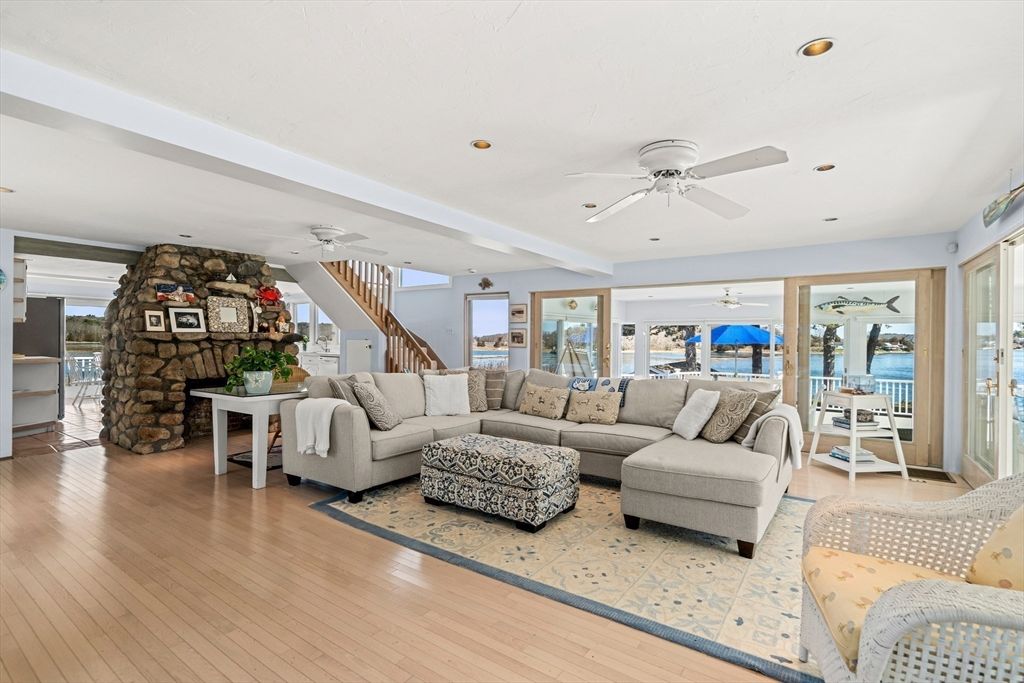 Fireplace, Interior, Living room, Recessed Lighting, Stone Walls, Water, Wood Texture Flooring