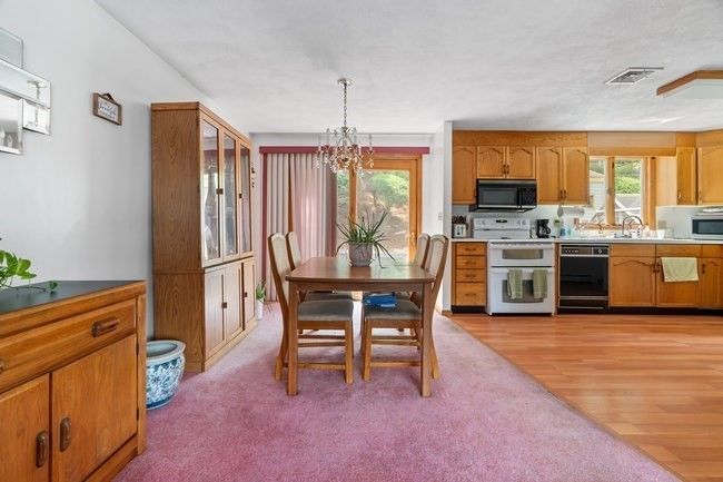 Chandelier, Dining room, Interior, Kitchen, Stainless Steel Appliances, Wood Texture Flooring