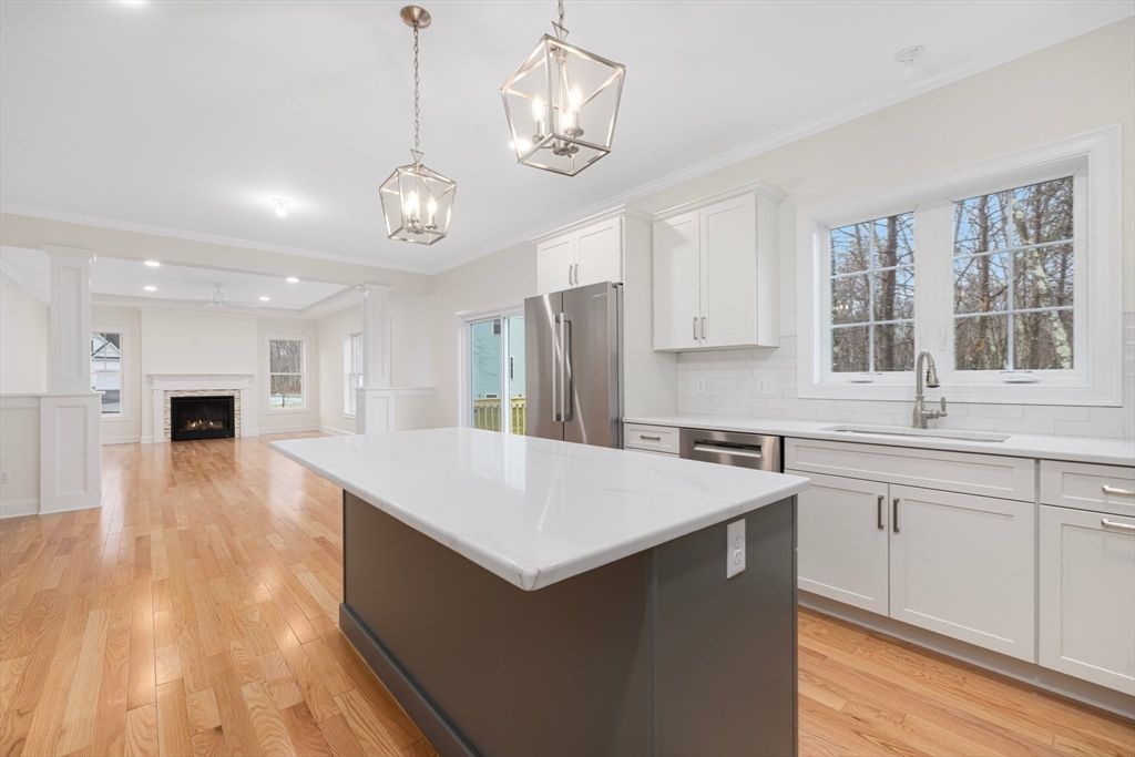 Fireplace, Interior, Kitchen, Pendant Lights, Recessed Lighting, Stainless Steel Appliances, Wood Texture Flooring