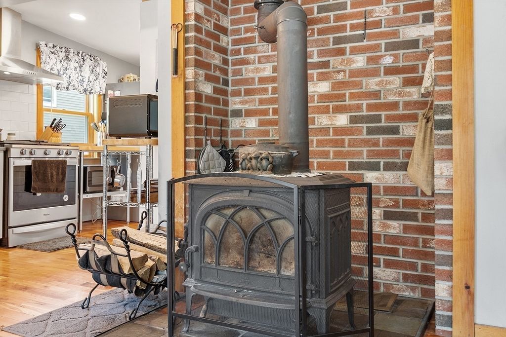 Fireplace, Interior, Recessed Lighting, Stone Walls, Wood Texture Flooring