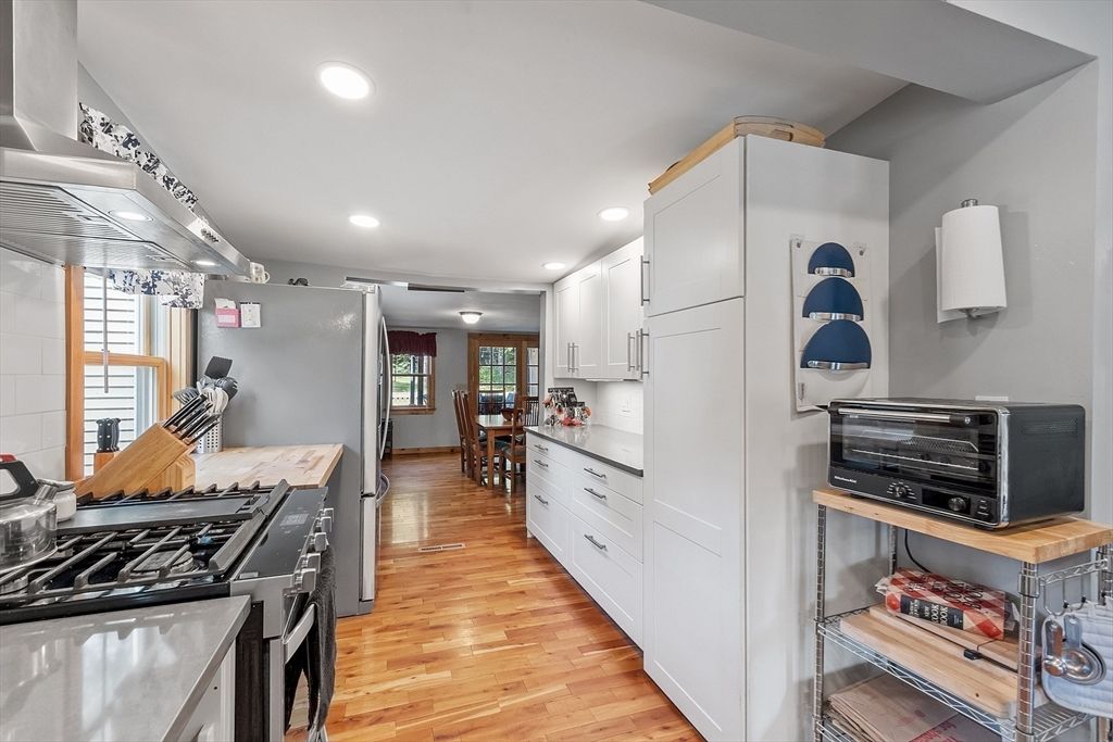 Dining room, Interior, Kitchen, Recessed Lighting, Stainless Steel Appliances, Wood Texture Flooring