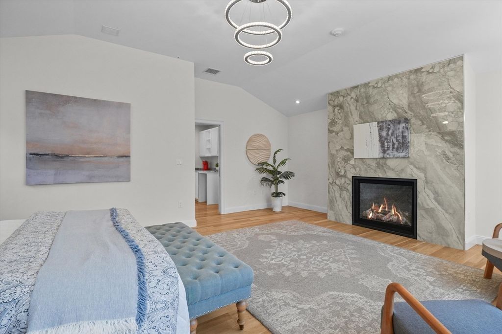 Fireplace, Interior, Marble Walls, Pendant Lights, Recessed Lighting, Wood Texture Flooring