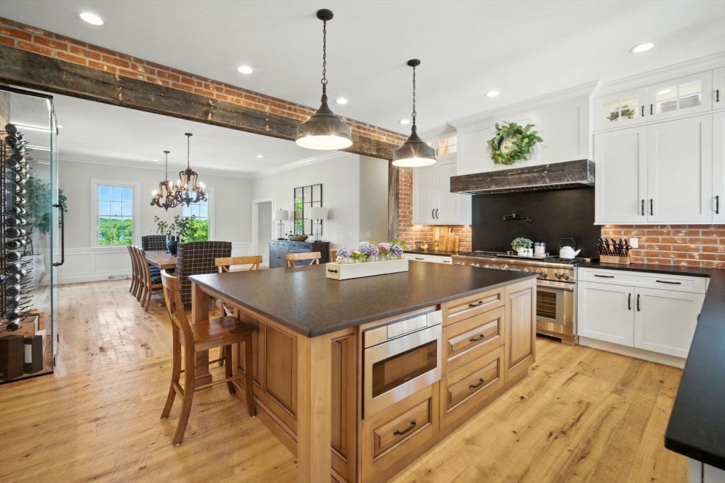 Chandelier, Dining room, Interior, Kitchen, Pendant Lights, Recessed Lighting, Stainless Steel Appliances, Wood Texture Flooring