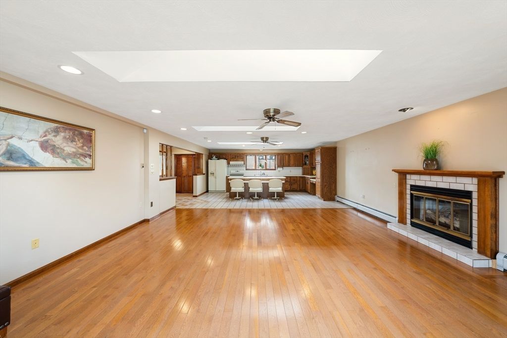 Dining room, Empty room, Fireplace, Interior, Kitchen, Recessed Lighting, Wood Texture Flooring