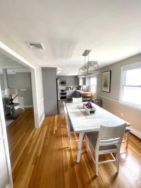 Dining room, Interior, Kitchen, Pendant Lights, Stainless Steel Appliances, Wood Texture Flooring