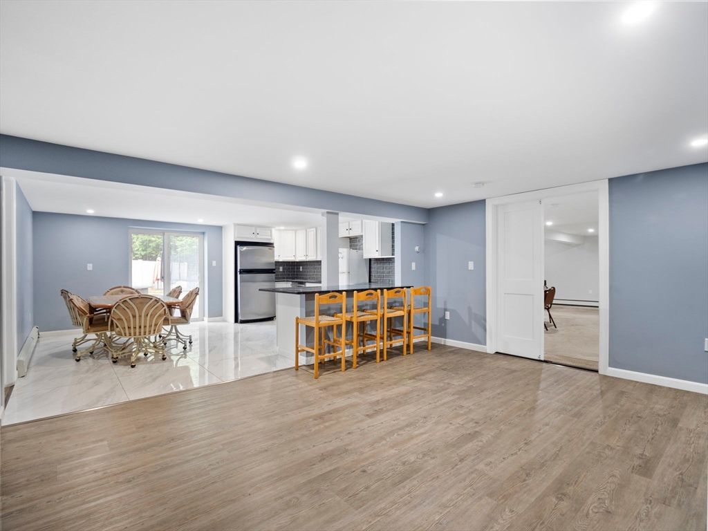 Dining room, Interior, Kitchen, Marble, Recessed Lighting, Stainless Steel Appliances, Wood Texture Flooring